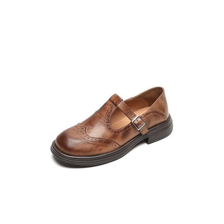 Brown wingtip Mary Jane flat shown on white background