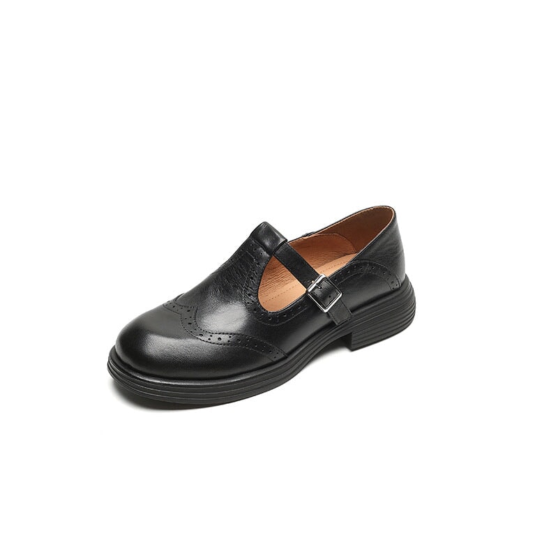 Black wingtip Mary Jane flat shown on white background
