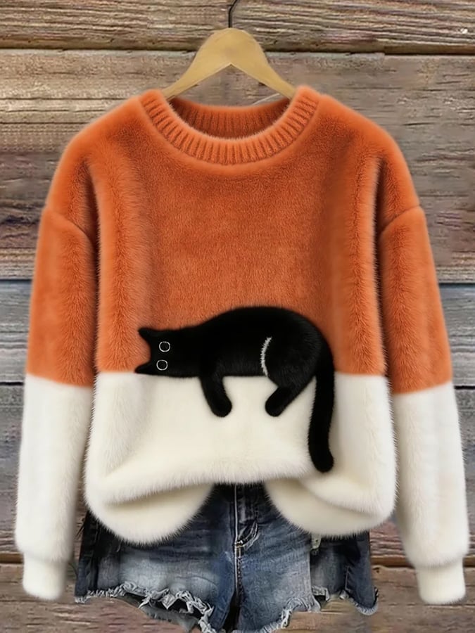 Orange and white colorblock cat graphic sweater