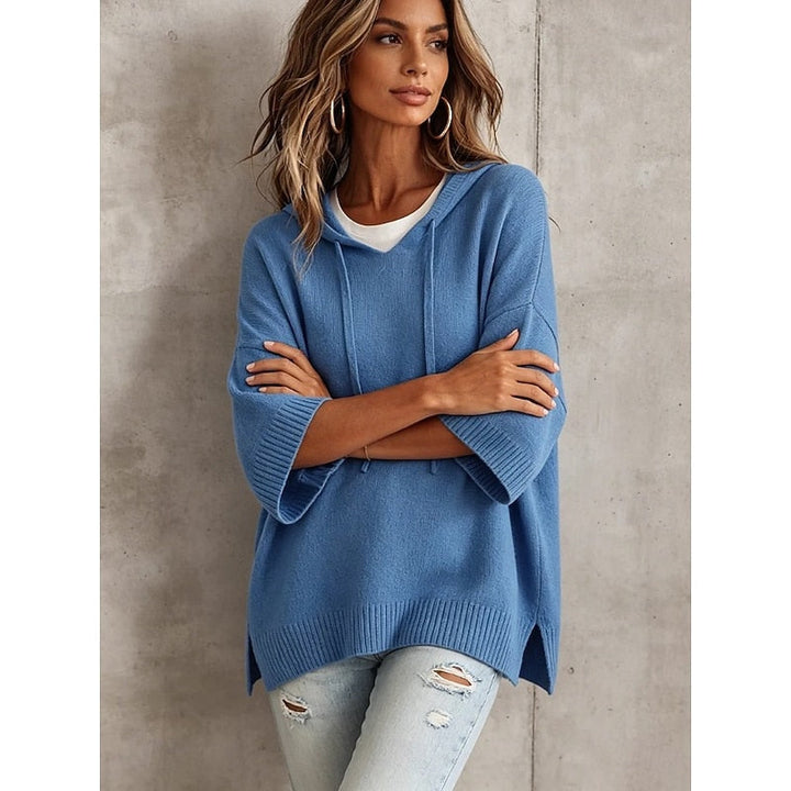 Blue hooded sweater with arms crossed, front detail