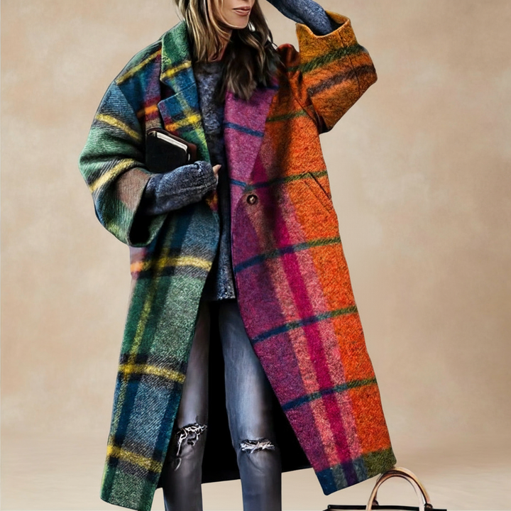 Woman wearing oversized orange and green plaid wrap coat