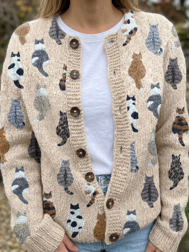 Woman wearing beige cat embroidery button front cardigan over white tee