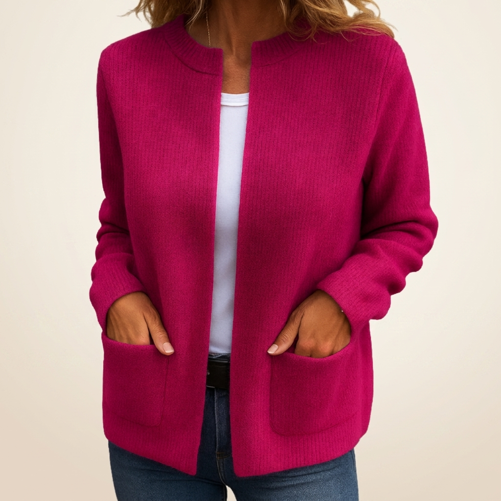 Pink ribbed knit cardigan with crew neckline and patch pockets
