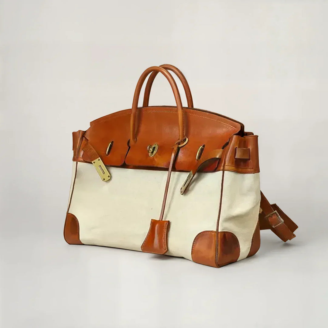 Light chocolate leather and canvas weekend bag, side angle view