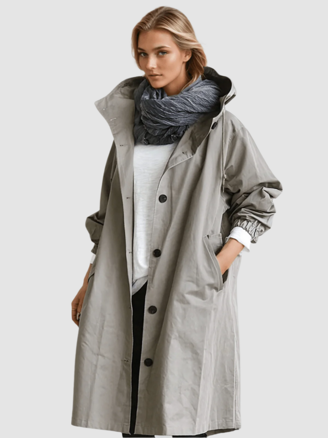 Woman wearing gray oversized hooded trench coat with scarf, front view
