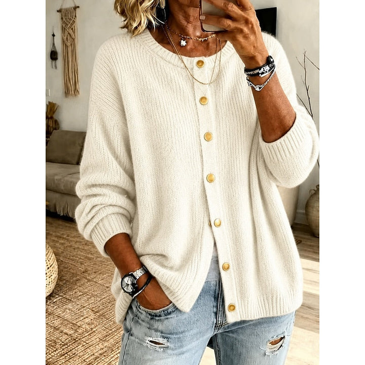 Woman wearing beige ribbed knit button-front cardigan