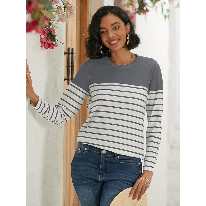 Woman wearing gray and white striped long sleeve top