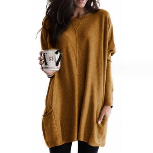 Woman wearing mustard tunic top with front pocket