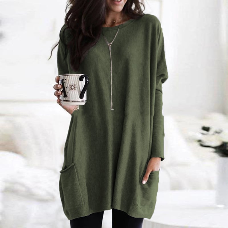 Woman wearing olive green oversized tunic top with front pocket