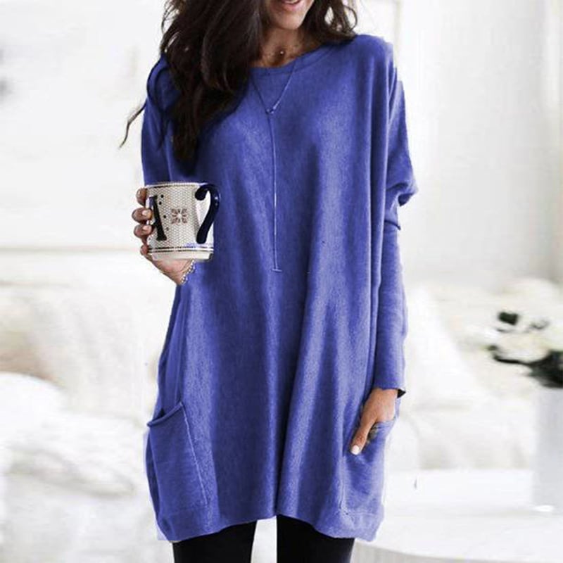 Woman wearing blue oversized tunic top with front pocket