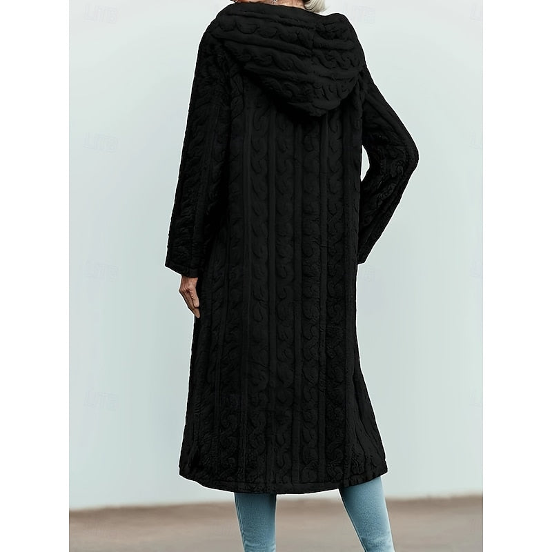Back view of black textured hooded longline coat with hood up