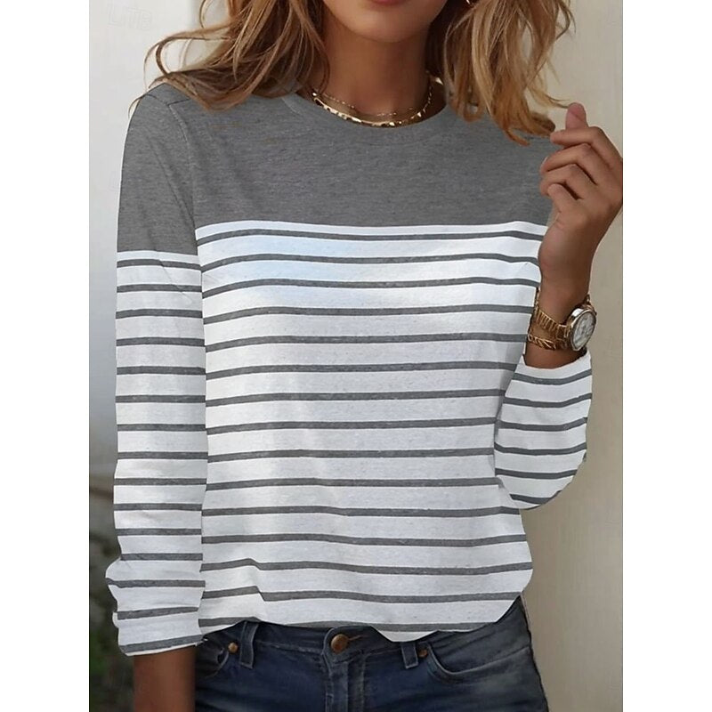 Close-up of gray and white striped long sleeve top with color block yoke