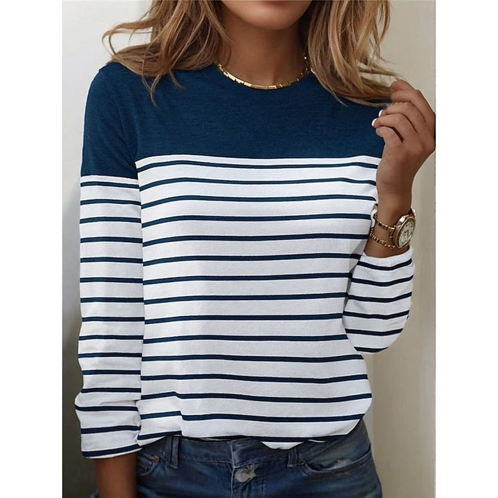Close-up of blue and white striped long sleeve top with color block yoke