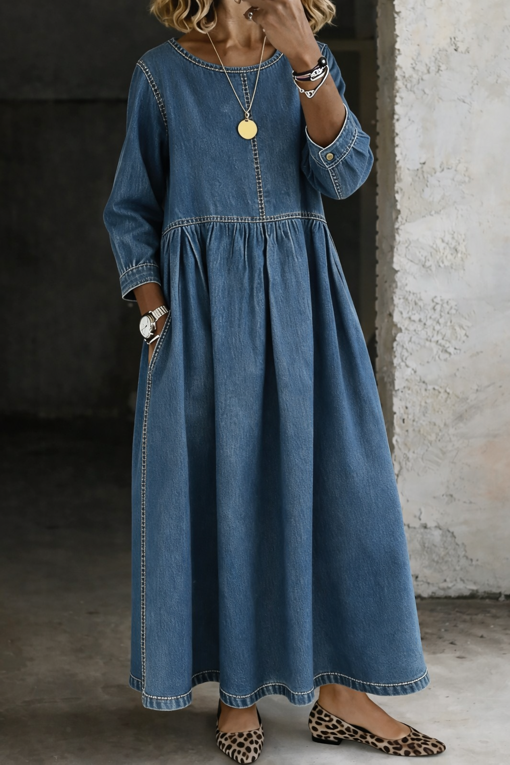 Woman wearing blue denim maxi dress with round neck and long sleeves