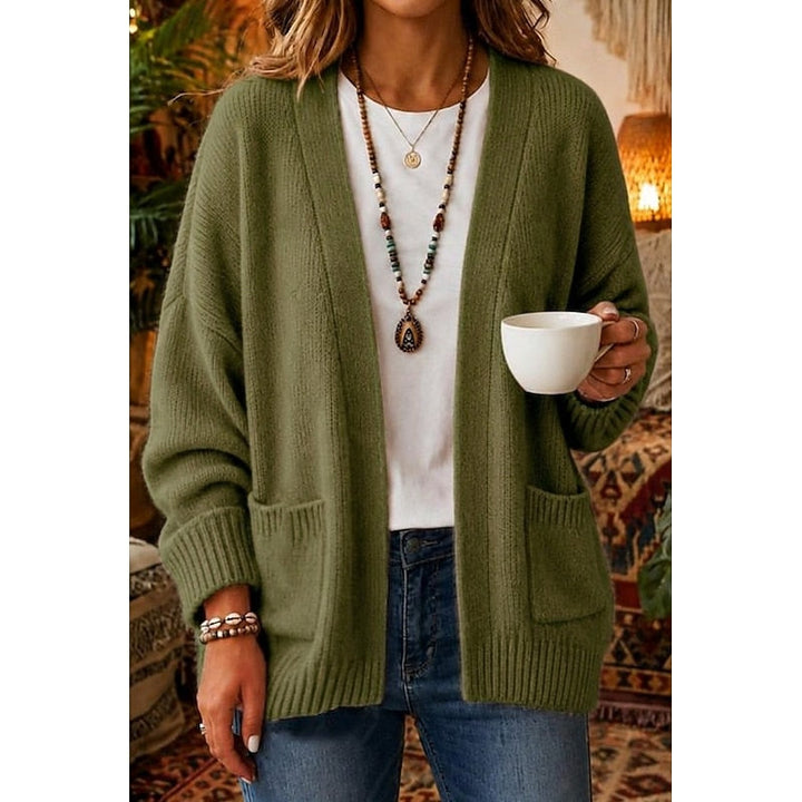 Woman wearing green open-front knit cardigan with patch pockets