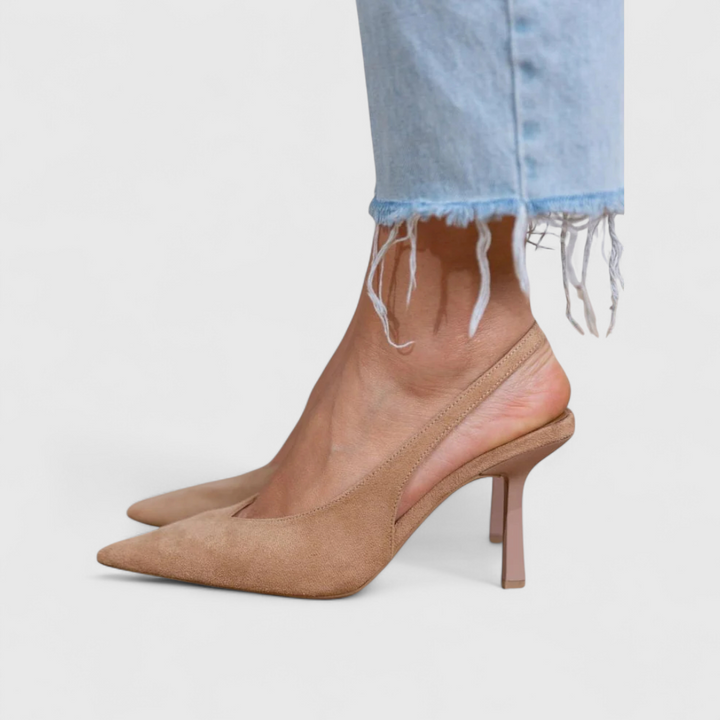 Beige suede slingback pointed-toe pump on model