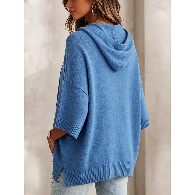 Back view of blue hooded sweater showing hood and drop shoulders