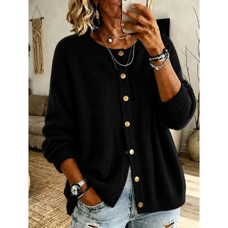 Woman wearing black ribbed knit button-front cardigan