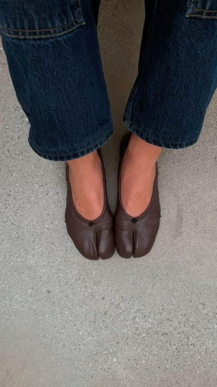 Brown split toe ballet flats with cuffed denim jeans