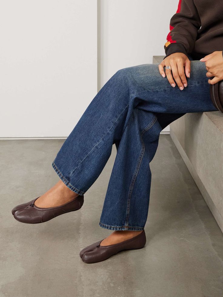 Brown split toe ballet flats paired with wide leg denim