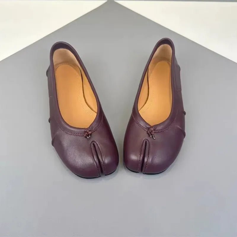 Burgundy split-toe leather flats, front view pair