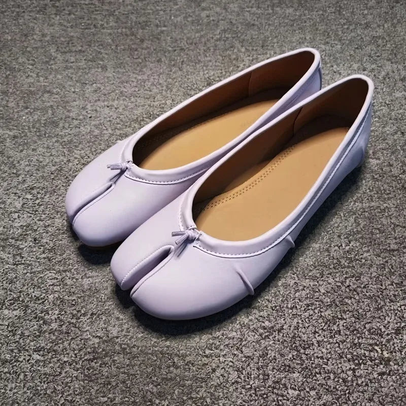 Lavender split-toe leather flats, angled front view