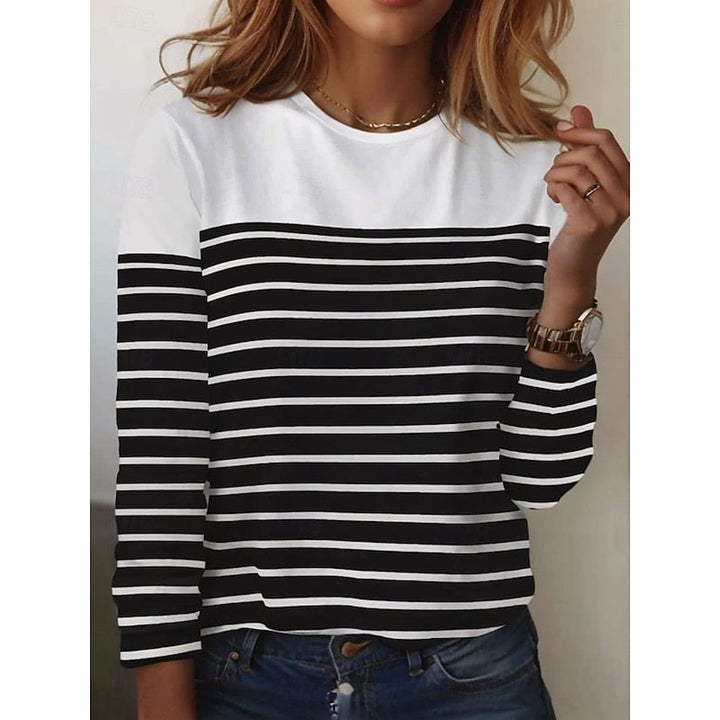 Close-up of white and black striped long sleeve top with color block yoke