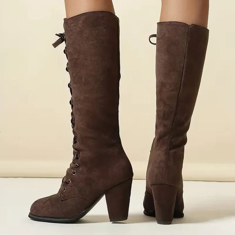 Back view of brown lace-up knee high boots showing block heel