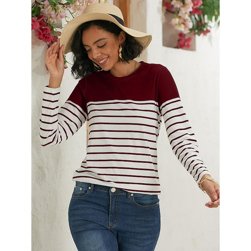 Woman wearing burgundy and white striped long sleeve top